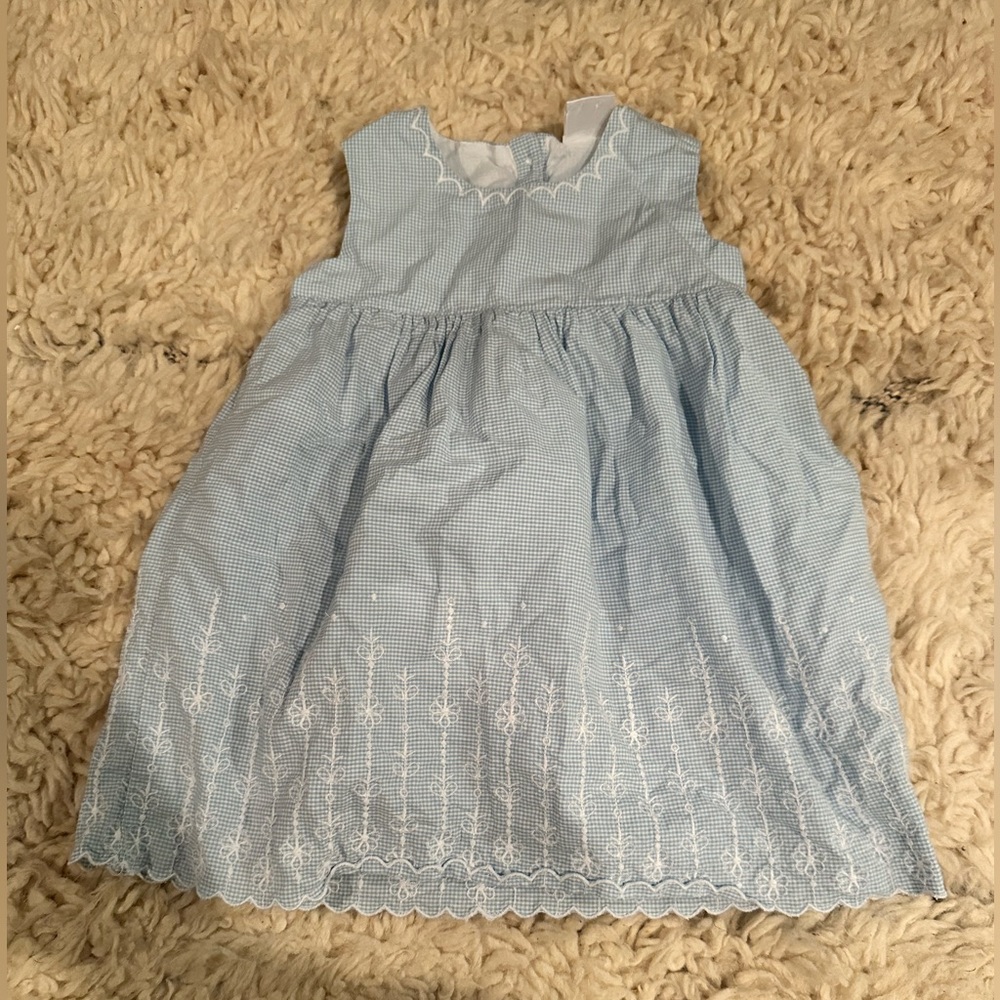 Blue dress with white embroidery